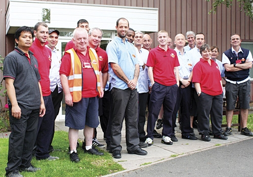 Relieved staff outside the Regis Road depot