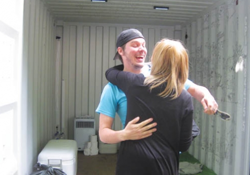 Paul Knight celebrates his release from the shipping container
