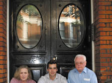 Residents Tess West and Max Trotter with Islington Leaseholders’ Forum chairman Brian Potter outside the doors 