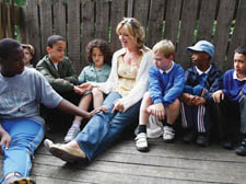 Penny with children at the adventure playground.