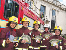 Councillor Marisha Ray, left, with firefighters outside the Town Hall