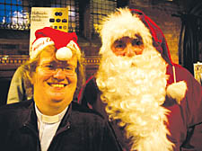 Minister Fionnaigh Reid with Union Chapel’s Santa Claus for the day at the festive fayre