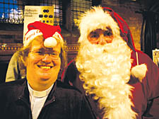 Minister Fionnaigh Reid with Union Chapel&rsquo;s Santa Claus for the day at the festive fayre