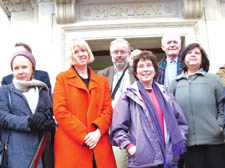 Labour councillors Richard Greening (centre) and Theresa Debono (far right) with protesters 