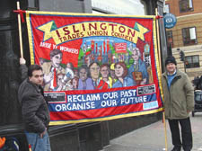 Mick Gilgunn, left, and Gary Heather show off the new banner symbolising 'a new campaign for workers' rights in Islington'