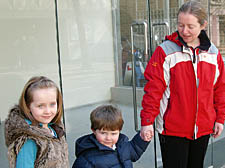 Resident Teresa Merrigan and her children, Carla, 6, and James, 3, outside the soon-to-open Spar