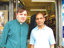 The Rev Martyn Saunders with newsagent Mr Patel