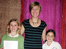 Award-winning poet Caroline Bird (centre) with Ellie Pollard and Maya Tysoe, both 10 