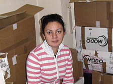 Rosalyn Black surrounded by boxes of her belongings