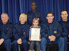 Schoolgirl Rachel Brewster with, from left, firefighters Colin Colyer, Keilly Flanagan, Jamal Bakkali, Christian Morphites and, at rear, Stephen Jordan