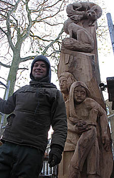 Tree sculptor Tom Harvey with the piece that he has created from the final elm tree at Highbury Fields