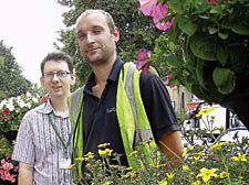 Steve Long on the left and Andrew Bedford of Islington’s floral team admiring one of their award-winning hanging baskets