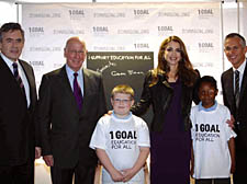 Dylan Skinner, 8, and Ore Olukoga, 11, share the stage with Gordon Brown, Sir Bobby Charlton, Queen Rania of Jordan and Gary Lineker