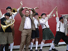 Charlie Talbot, who plays the part of financier Max Klein, with his show’s brass band ensamble 