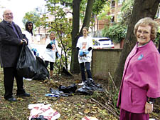 Dame Elisabeth Hoodless removing rubbish with volunteers at a derelict site in Rodney Street