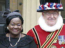 Ms Arnold with a Queen’s warden at Buckingham Palace