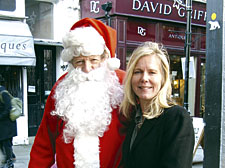 Father Christmas (trader Finbar MacDonnell) with Christine Lovett