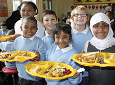 Pupils at Ambler Primary School in Blackstock Road prepare to tuck into their free meals