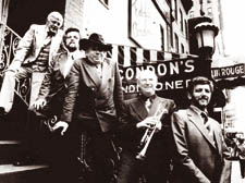 John Chilton, tumpet in hand, with George Melly and the Feetwarmers