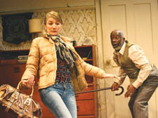 Maria (Lydia Leonard) is chastised by her boss, Alfred (Joseph Marcell)