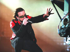 U2 frontman Bono reaches out to the audience in the band's 3D spectacular