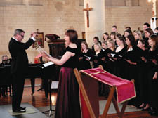 Ivor Setterfield (left) conducts the New London Singers in All Hallows Church on Saturday