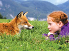 Bertille Noel-Bruneau makes a new friend on her way to school in Luc Jacquet's The Fox and the Child