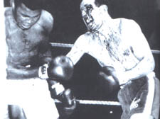 Muhammad Ali takes a big hit against Henry Cooper at Wembley Stadium