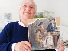Marian Kamlish with the painting that turned out not to be trash