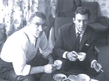 Ron and Reg Kray relax with a cup of tea at home after being questioned by police over the death of rival gang member George Cornell 