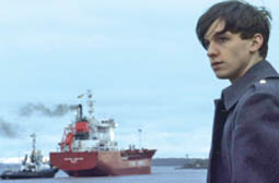 Carty, played by Nick Bell, has yet another reflective moment on the banks of the Mersey in Awaydays