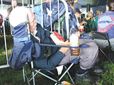 A Glastonbury reveller doesn&rsquo;t let the music get in the way of his afternoon nap