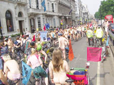 Hundreds of naked protesters took to the streets of the capital on bicycles to make a stand against car pollution