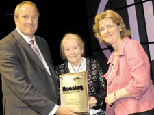 Ms Kelly ( pictured right) presenting the awards to its chief executive Brian Johnson and board member Mary Nicholas at the Chartered Institute of Housing’s annual conference.