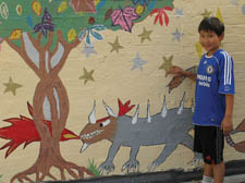 Year 6 pupil Raksha Patel is pictured showing off part of the mural.  