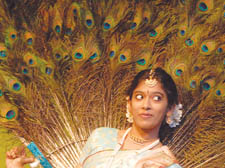 An Aspara artist performs the the dance of the peacock, the national bird of India.
