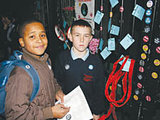 Pimlico pupils Cedric Thompson, 13, and Jake Fairman, 13, outside the gates of the school on Thursday