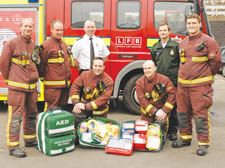 Paddington fire station crew with Westminster borough commander Archie Chandler (white shirt) and Stephen Hines, clinical support manager for London Ambulance Service