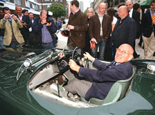 Stirling Moss at the wheels of a C-Type Jaguar