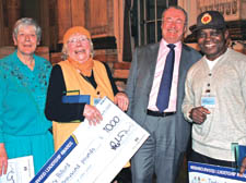 Elizabeth Virgo, Ivy Billard and Isola Akay, far left, receive their cheques from Colin Barrow, the leader of Westminster Council