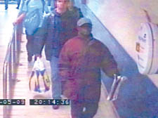 The man, in a baseball cap, on CCTV at Finsbury Park Tube station