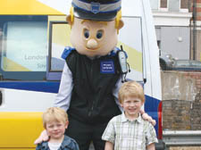 Getting to know you: Brother Carson, 3,  and Cole Stevens, 5, meet PCSO Steve  (aka PCSO Darren Grigg)