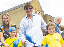 Assistant headteacher Louise Prevett, Jack White, 6, Sean Bean, and Phoebe Millard, 7, try their hands at fishing for dolphins