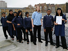 Members of the award-winning SCCS eco committee beside the 30,000 solar panels
