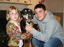 Nicole, 8, and Asher Fingerhut 13, with their pet lurcher Bobby 