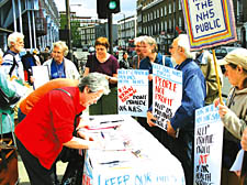 Members of the public sign the NHS petition in Camden Town at the weekend