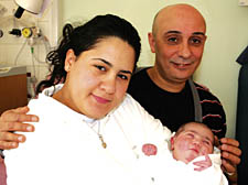 Baby Manal Mouftah with parents Abd el Majid Mouftah and Mouna el Khalid Mouftah