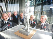 Veterans with a model of the Sir Keith Park statue.